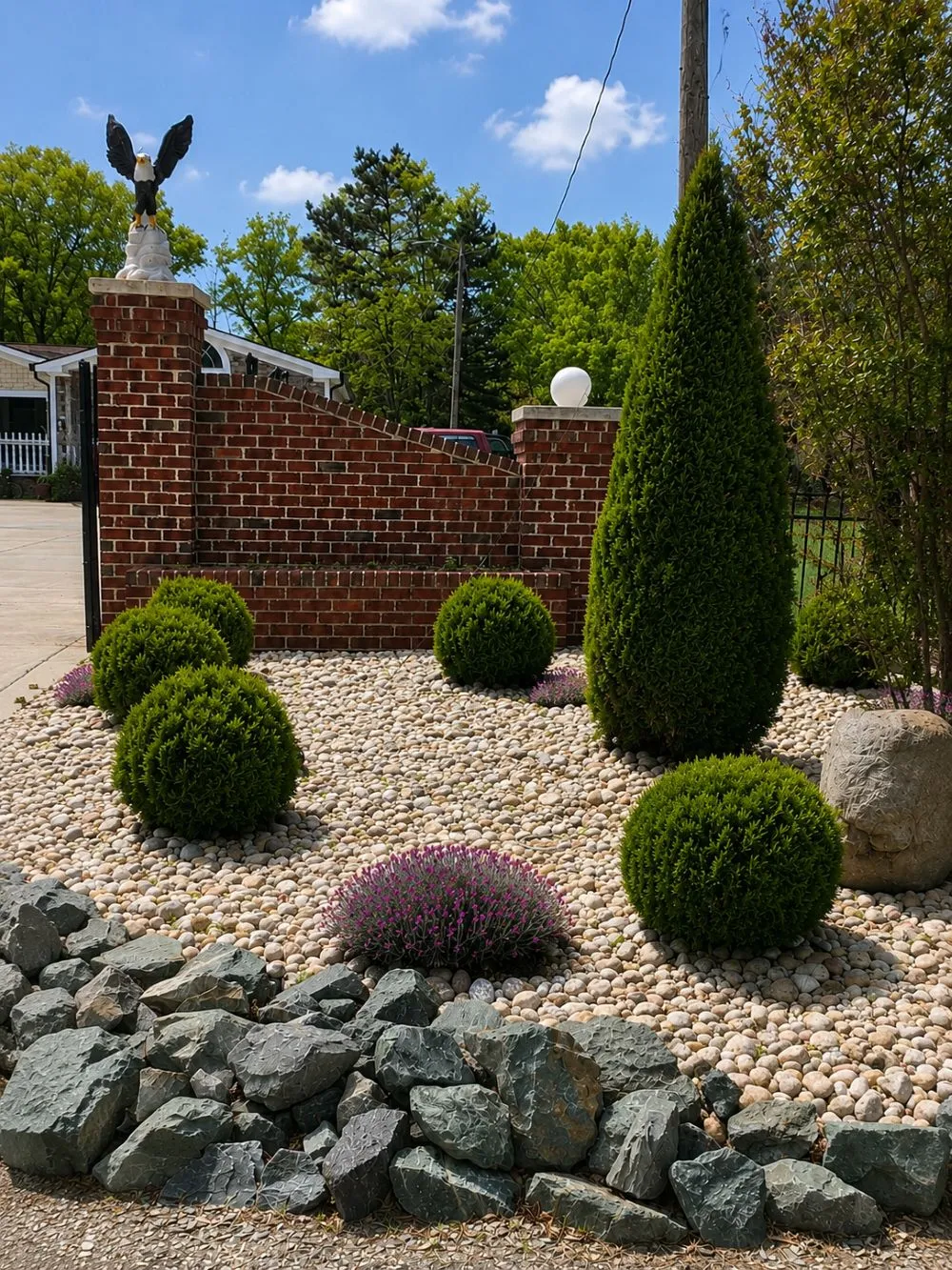 Brick Entry Wall & Rock Garden: Brick Installation · Landscaping. Completed project by J & A Ground Maintenance.