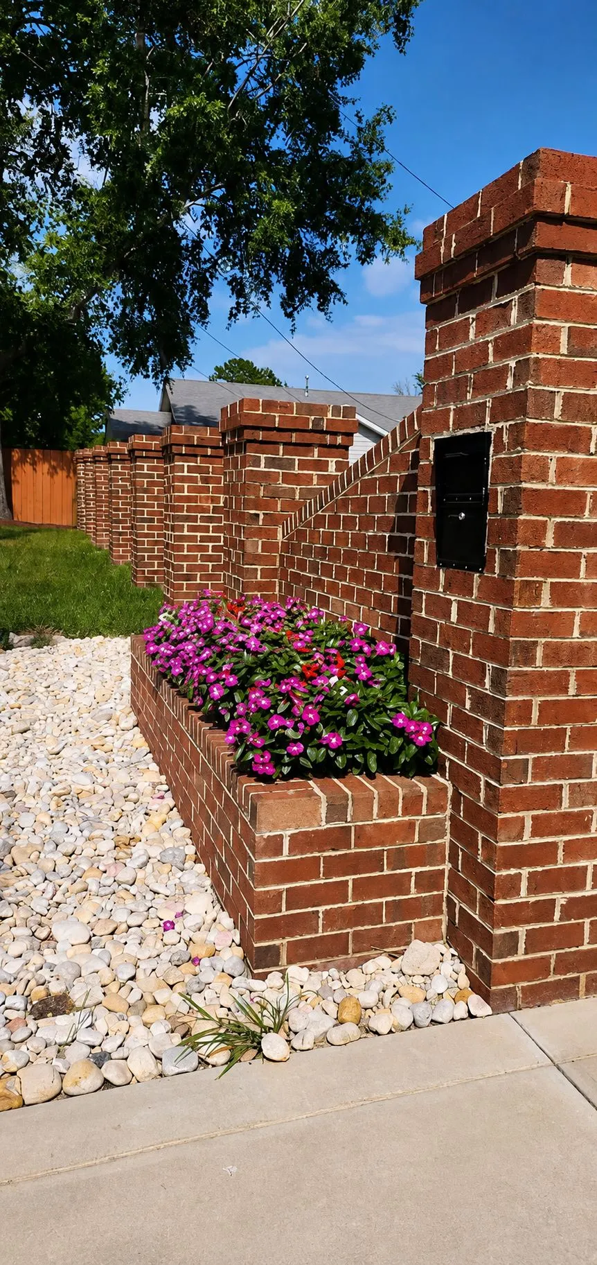 Brick Wall & Flower Planter: Brick Installation · Landscaping. Completed project by J & A Ground Maintenance.