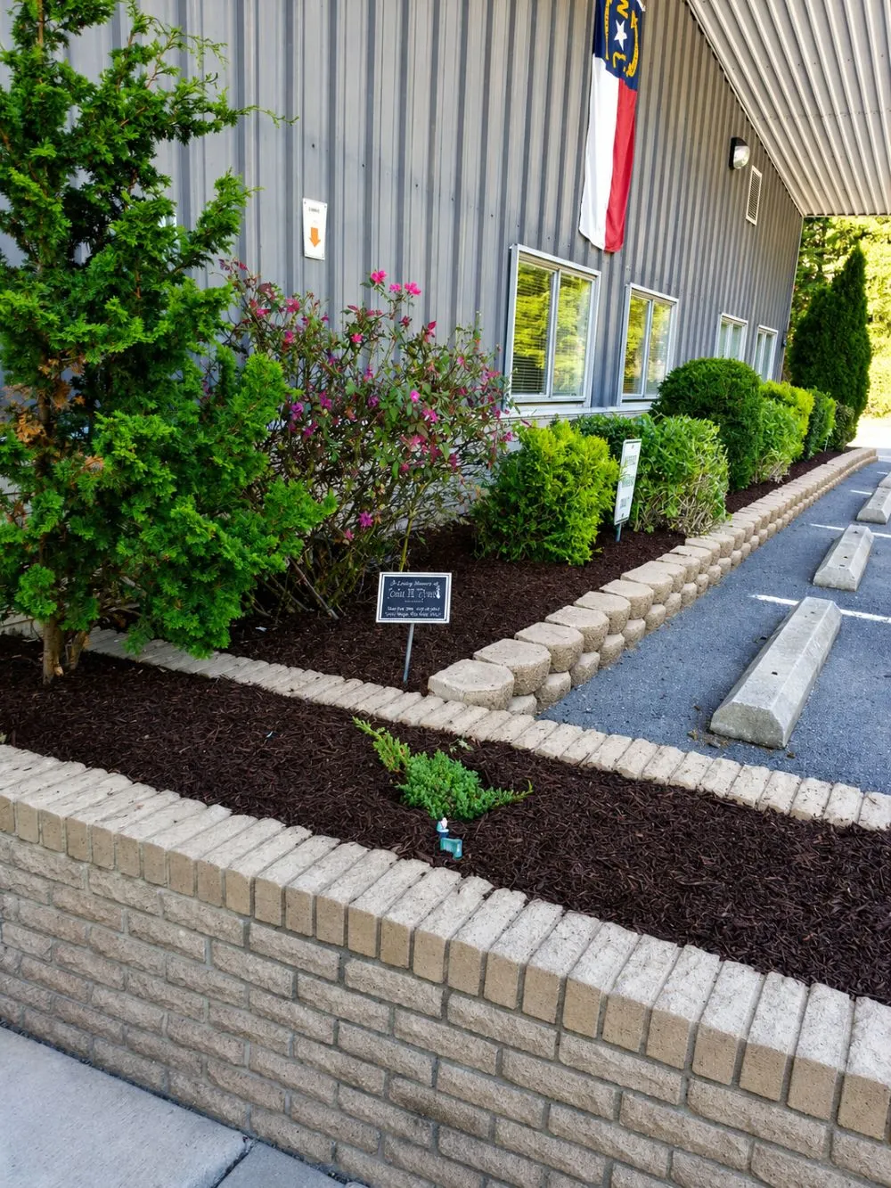 Commercial Landscape Refresh: Landscaping · Brick Wall. Completed project by J & A Ground Maintenance.