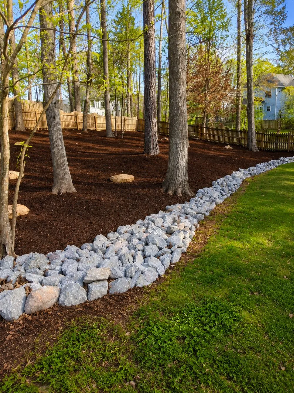 Wooded Bed Rock Border: Landscaping · Drainage Border. Completed project by J & A Ground Maintenance.
